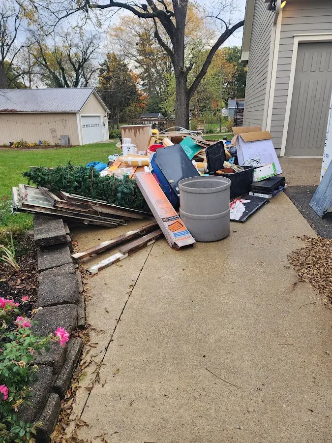 Dumpster being loaded with debris for 3 Yard Dumpster Rental in Litchfield